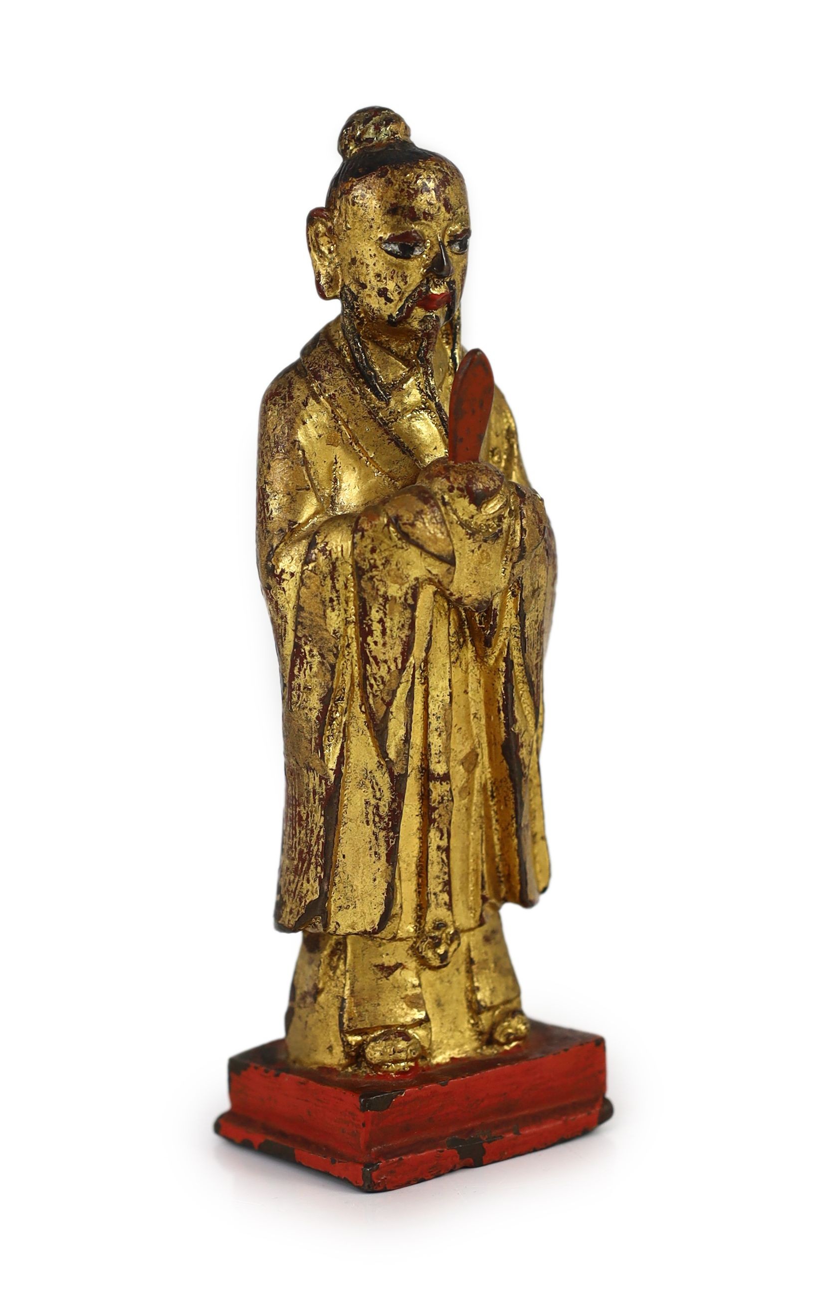A Chinese Ming lacquered bronze figure of an official holding a tablet, 15cm